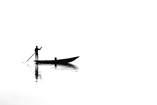 Boat on the lake . And its create amazing shadow in the water.