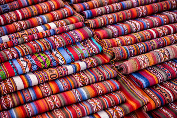 colorful peruvian fabrics for sale, market the sacred valley - bedding merchandise market textile imagens e fotografias de stock