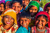 istock Group of happy Gypsy Indian children, desert village, India 1473659285