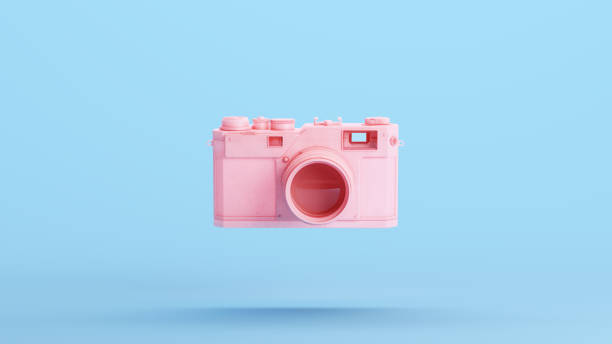 istock Pink Camera Lens Retro Style Nostalgia Gen Z Kitsch Blue Background 1473660626