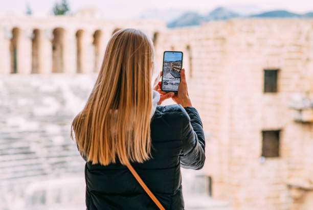 istock Young Woman Exploring Ancient Amphitheater 1473662399