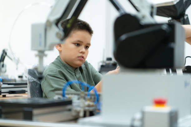 istock Children using the hand robot technology, Students are studying technology, which is one of the STEM courses. 1473663546