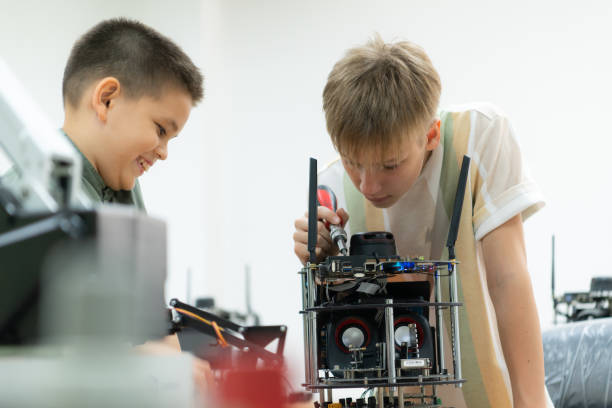 istock Children using the hand robot technology, Students are studying technology, which is one of the STEM courses. 1473663562