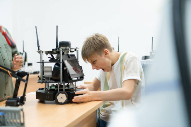 istock Children using the hand robot technology, Students are studying technology, which is one of the STEM courses. 1473663588