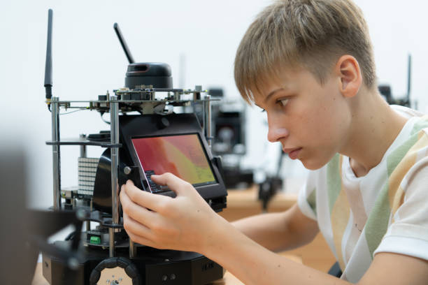 istock Children using the hand robot technology, Students are studying technology, which is one of the STEM courses. 1473663623