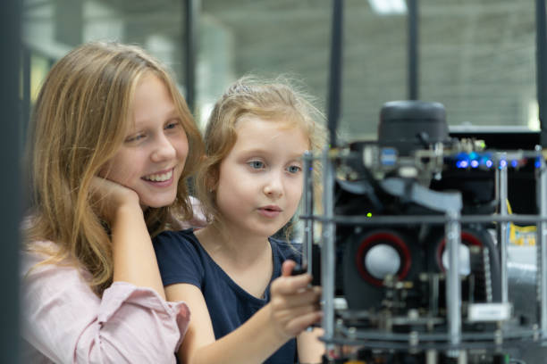 istock Children using the hand robot technology and having fun Learning the electronic circuit board of hand robot technology, which is one of the STEM courses. 1473664436