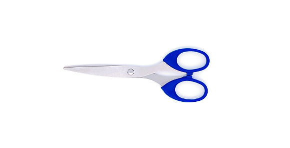 Scissors with blue handle isolated on white background. Selective focus. Top view or flat lay.