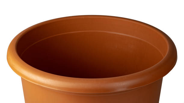 istock Brown plastic flower pot isolated on a white background 1473666622