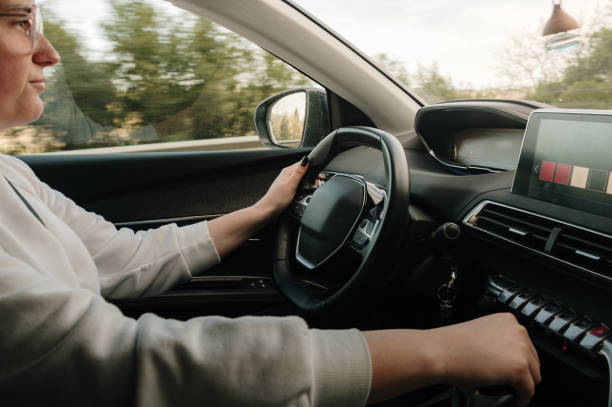 istock Woman driving a car 1473666757