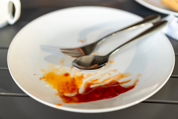 istock Top view of empty plate. Dirty plate with food leftovers. 1473666809