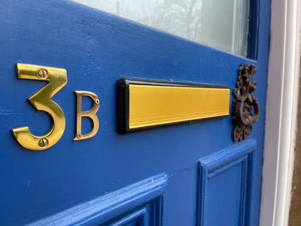 istock Vintage door knocker on a blue door 1473667524