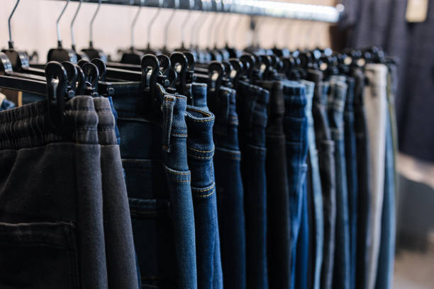 istock Rack with jeans in a clothing store. Different jeans on a hunger 1473667726