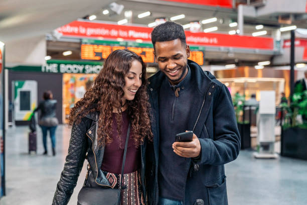istock Happy Young Couple Using Phone 1473667912