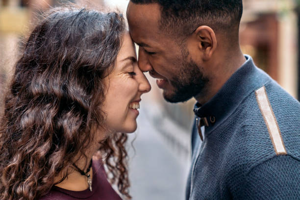 istock Happy Young Interracial Couple Kissing 1473668006