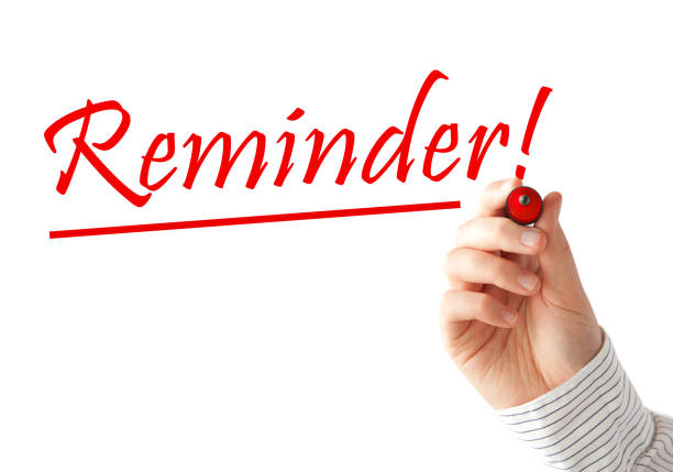 istock Reminder text and hand with red marker 1473668279