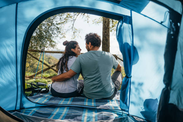 istock Couple waking up during their camping in mountain 1473669057