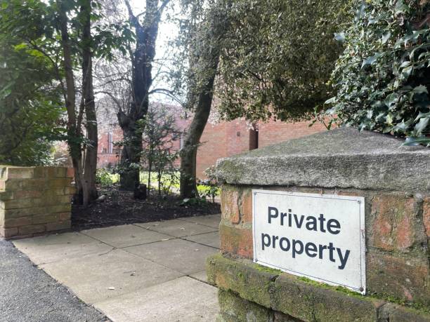istock Private property sign on a brick fence 1473671004