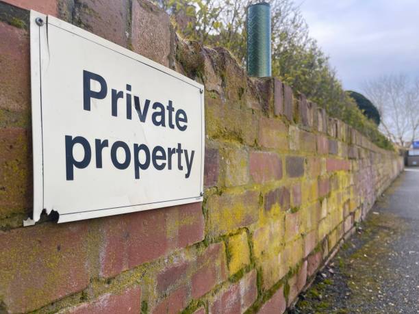 istock Private property sign on a brick fence 1473671364