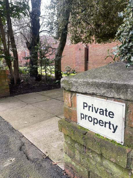 istock Private property sign on a brick fence 1473671365