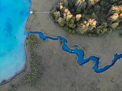 Austria drone view. Meanders among reeds on Lake Faak (Faaker See) in Carinthia state.