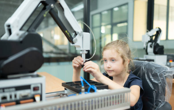 istock Children using the hand robot technology, Students are studying technology, which is one of the STEM courses. 1473674771