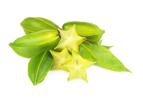 Green star fruits or averrhoa carambola whole and sliced isolated on white background.
