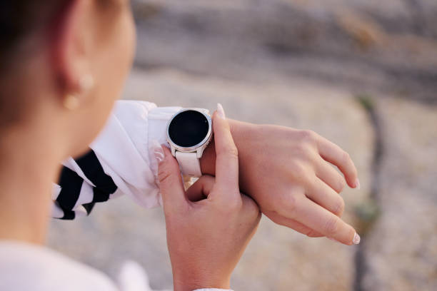 istock Smartwatch, fitness and training outdoor, check time and hand after exercise, workout and running in street. Digital technology, marathon and runner hands zoom, heart rate and app for run speed 1473679110
