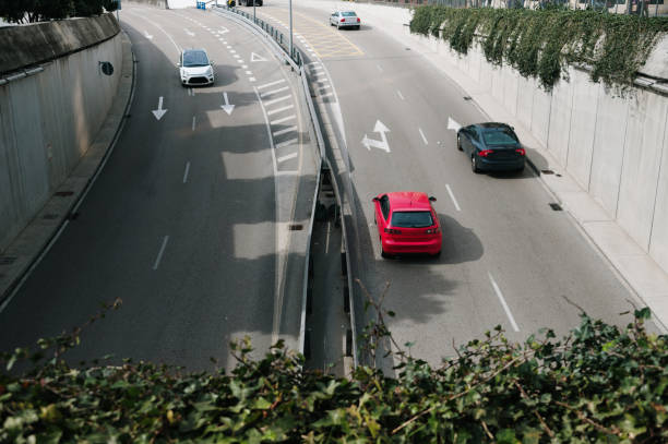 istock Cars on a two lane road 1473679747