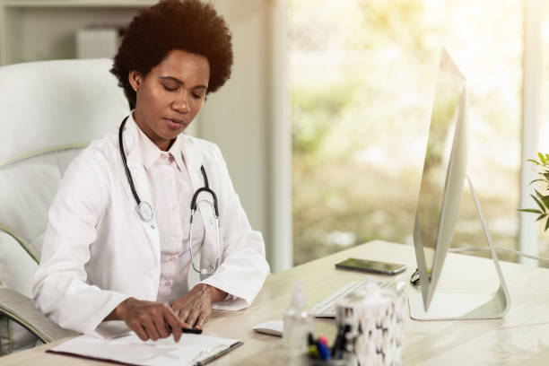 istock Black Female Doctor Working In Her Office 1473682332