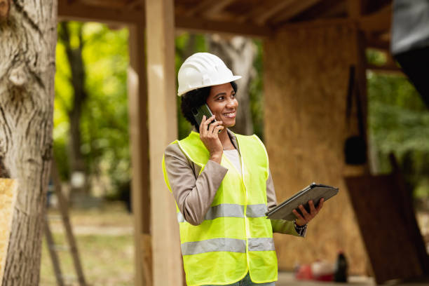 istock Black Woman Architect Talking On A Smart Phone At Construction Site 1473682352