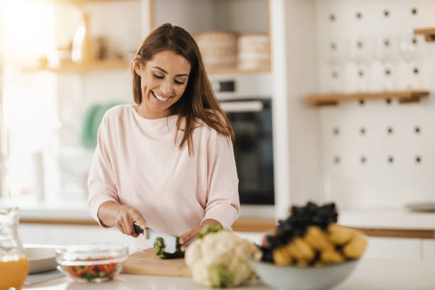 istock Woman Preparing A Vegetables Meal In The Kitchen 1473682485