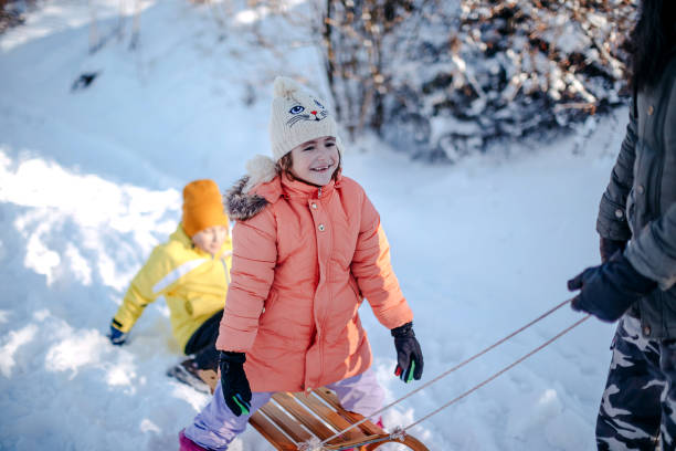 istock Family having fun on snow in the nature 1473682565