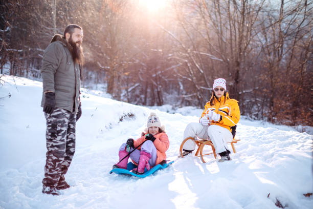 istock Family having fun on snow in the nature 1473682633