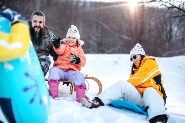 istock Family having fun on snow in the nature 1473682721