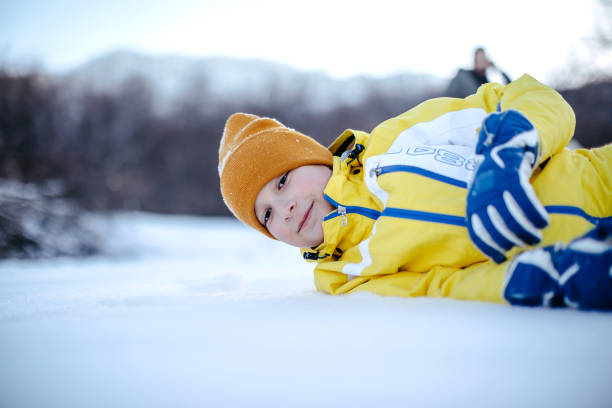 Family spending quality time on snowy mountain in winter