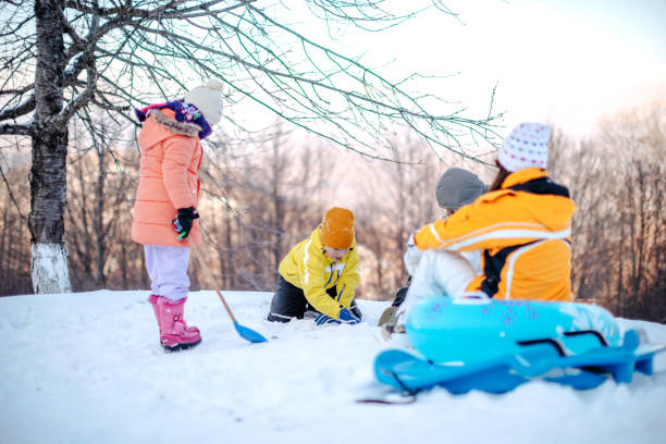 istock Two kids having fun on snow in nature 1473682829