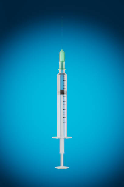 istock Disposable syringe filled with transparent liquid on a blue gradient background. Vaccination concept. An injection of medicine, an antibiotic. 3d render. 1473683362