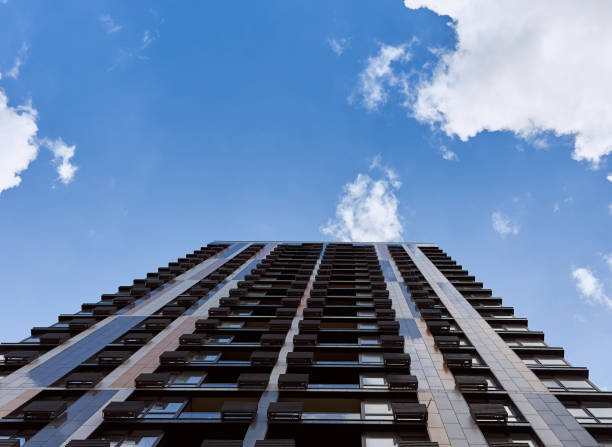 istock Modern residential skyscraper and beautiful blue sky and bright white clouds. 1473684426