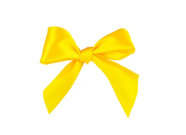 Photo of Yellow ribbon bow isolated on white