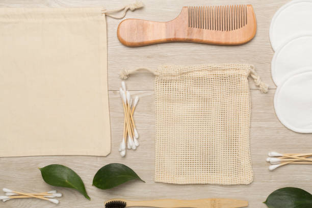 istock Flat lay with natural biodegradable accessories on wooden background, top view 1473685188