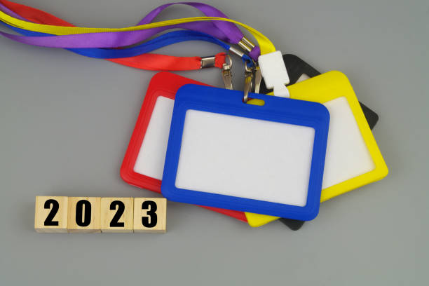 istock Colorful blank badges with strings and numbers 2023 on wooden cubes. 1473686820
