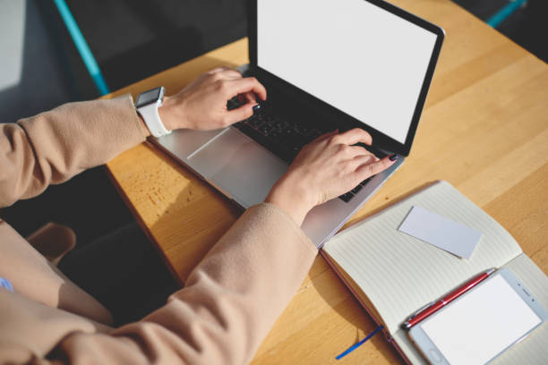 istock Crop faceless woman working on laptop 1473687829