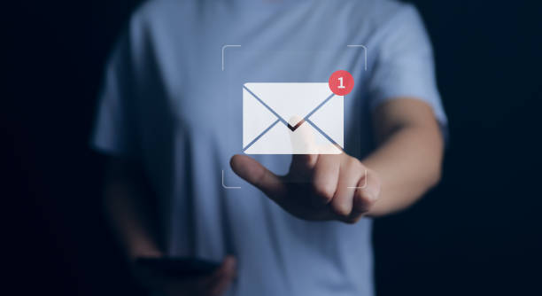 istock New email notification concept. Woman touch on email in virtual screen. for business e-mail communication and digital marketing. Inbox receiving electronic message alert. Internet technology. 1473689460