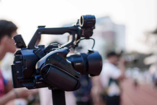 istock Video camera operator Professional camera filming a video podcast 1473689659