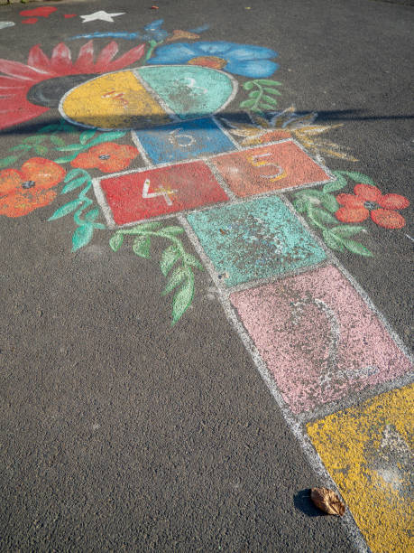 istock colored hopscotch game on asphalt 1473691673