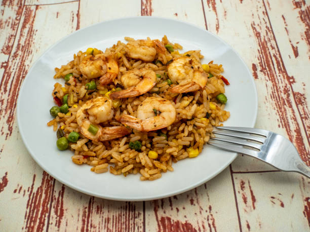 istock plate of shrimp fried rice with vegetables 1473695434