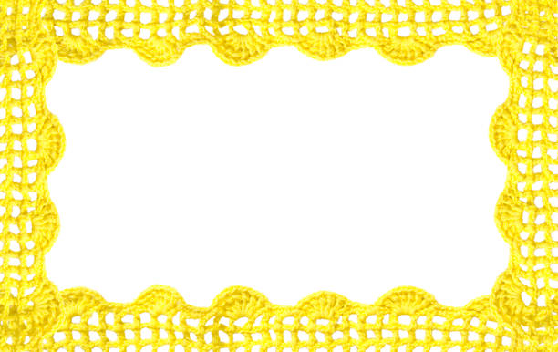 Crocheted yellow lace on a golden background.