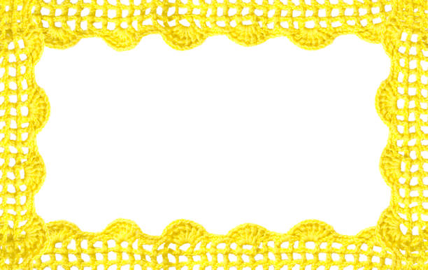 Crocheted yellow lace on a golden background. Crocheted yellow lace on a golden background. lacemaking photos stock pictures, royalty-free photos & images