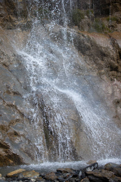 istock Beautiful waterfall in the mountains. Water flows down from the mountains. 1473697558
