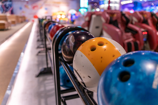 Colorful bowling balls in return machine